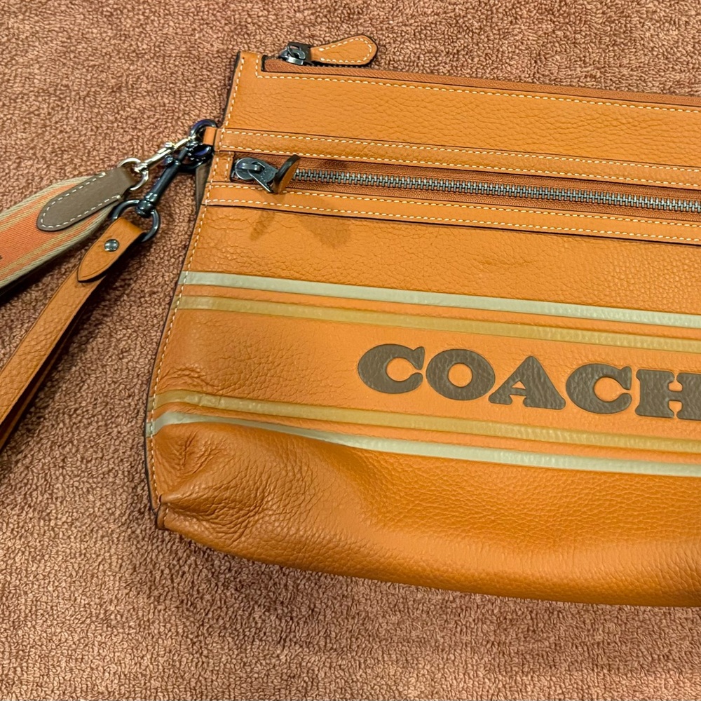 Authentic medium size clutch coach with alternate strap, new